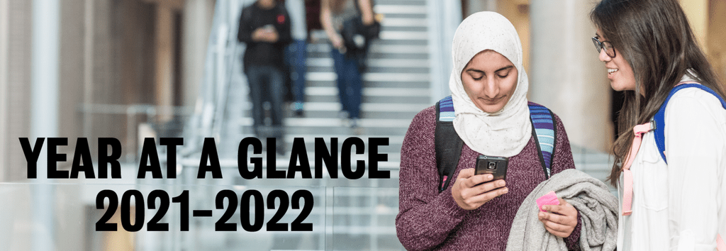 Two students looking at a phone. Text reads "Year at a glance 2021-2022"