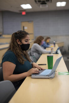 Student with face mask in classroom