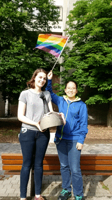 Gabriella Verdone and Judy Liu with Pride flag.