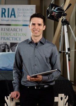 Robert with patient, tablet and imaging camera 