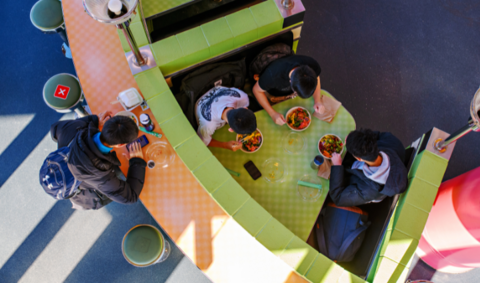 Students grabbing a bite to eat together at DC Bytes.