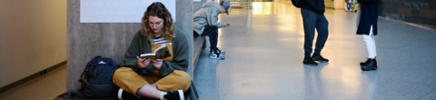 student sitting on ground reading