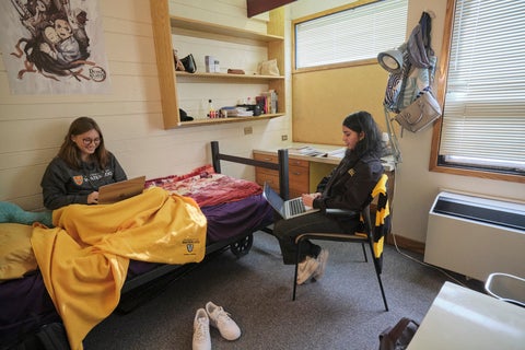 Two students sitting in a single room in Minota Hagey