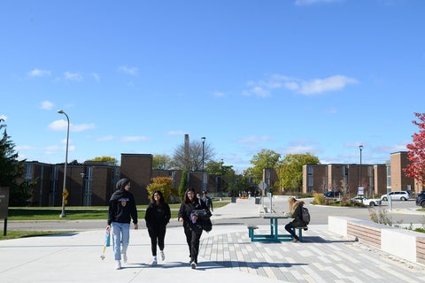 Students walking outside Village 1