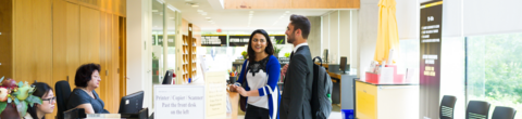 students getting support from the service desk in Tatham Centre