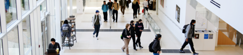 students walking through faculty of health building