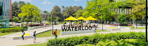 University of Waterloo sign outside of Dana Porter Library in the summertime
