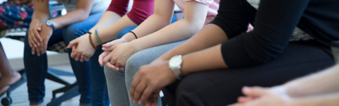 image showing students sitting with hands on their laps 