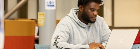 Student looking at their computer