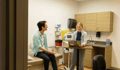student and nurse in appointment room 