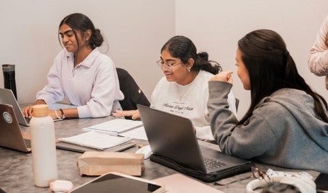 3 students studying together