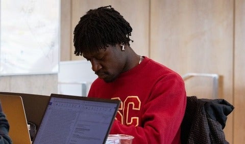 Student studying at laptop