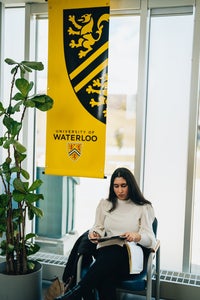 student sitting looking at notes, waiting for an interview with prospective employer at Tatham Centre