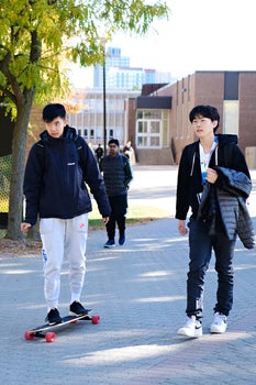 two students walking through campus