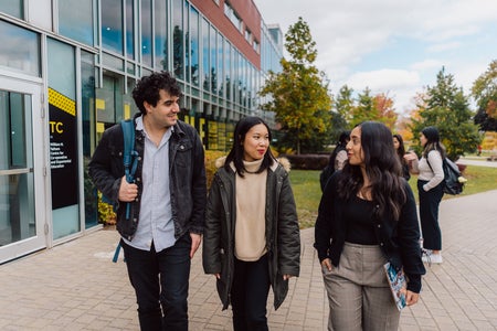 students walking and talking outside of Tatham Centre