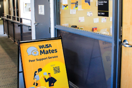 A-frame signage promoting WUSA Mates outside of their office in SLC.
