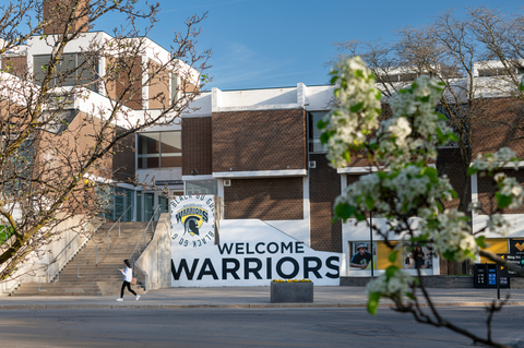 image of a building on campus with the words "welcome warriors" on the buidling