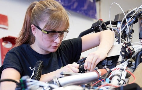 a female engineering student works on a project