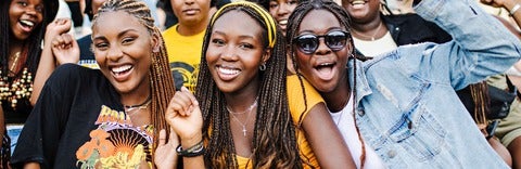 Three Black girls smiling together