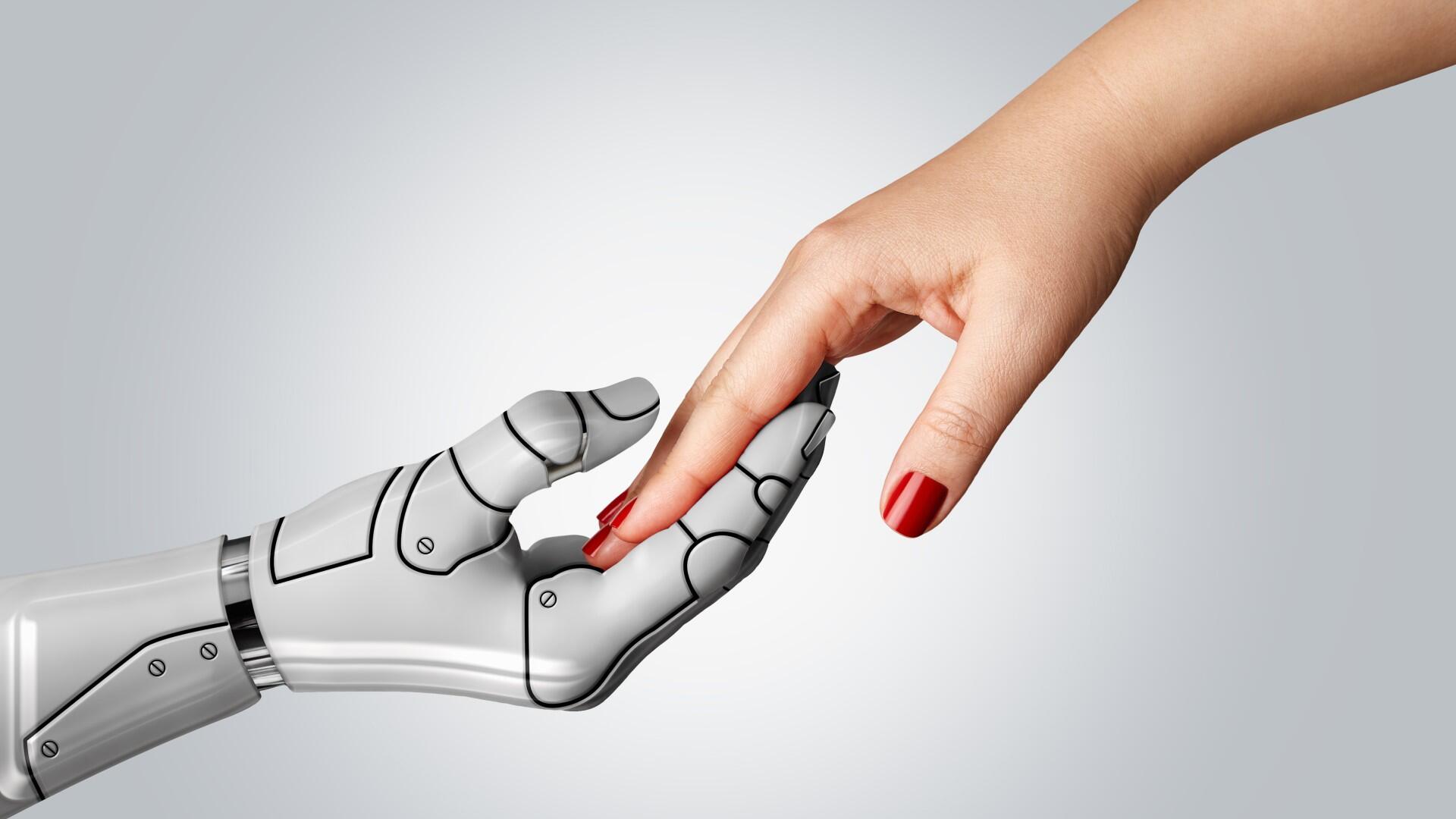 Robot hand touching a human hand