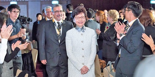 Carrie Lam, Chief Executive of Hong Kong, and Feridun Hamdullahpur arrive at an event 