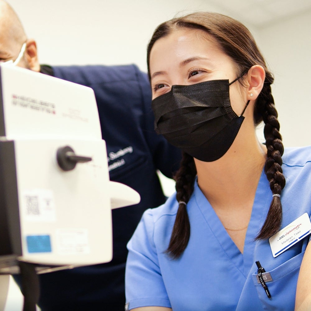 Student conducting eye exam