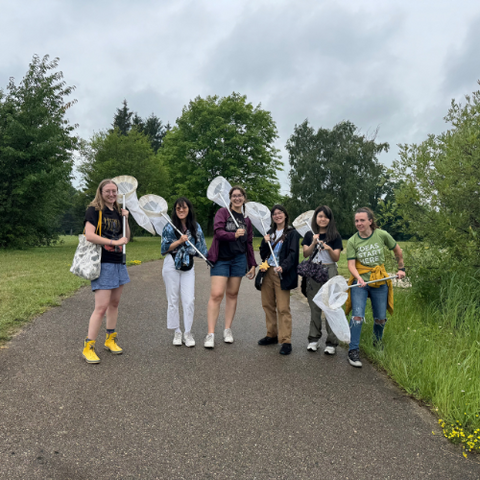 Attendees at BioBlitz posing with butterfly nets