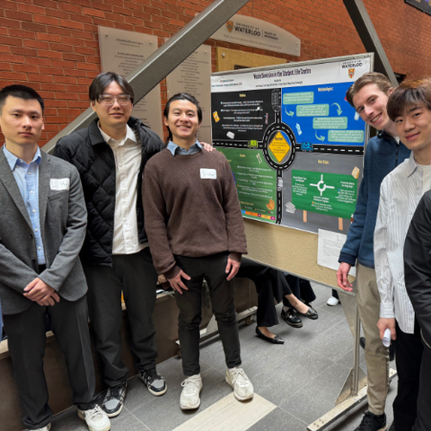 Students presenting Living Labs poster presentation in EV3 atrium