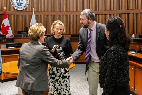 Mat Thijssen and Stepanka Elias accept the Water Efficiency Excellence Award from Region of Waterloo Chair Karen Redman in Regional Council