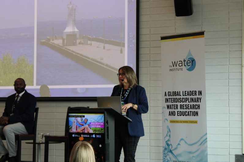 One of the panelists presenting at the podium