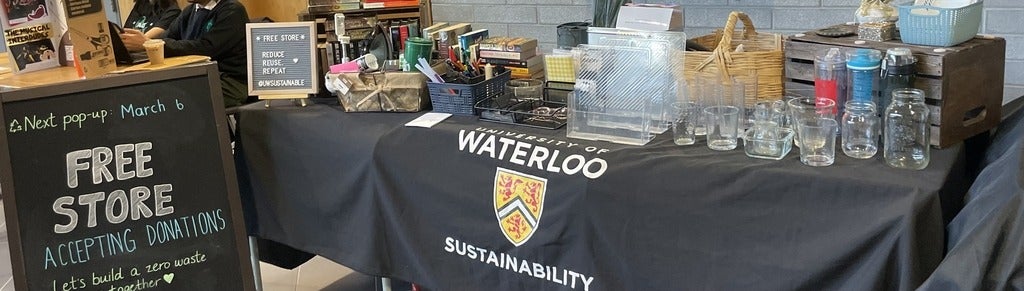 Free Store table with items and sign