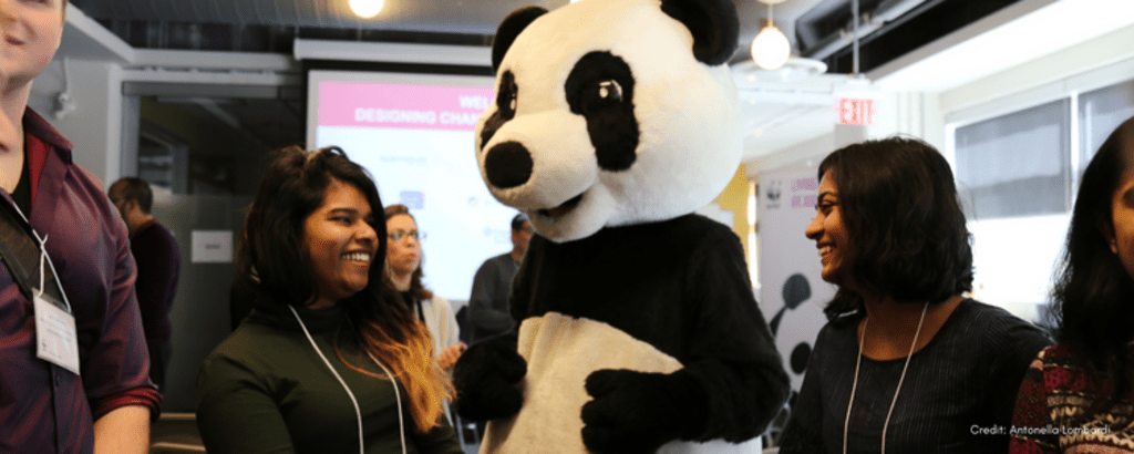 Two UWaterloo students with WWF Canada panda mascot at 2019 hackathon