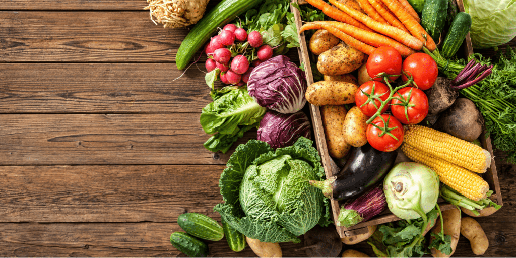 Aerial view of assorted vegetables on wooden table