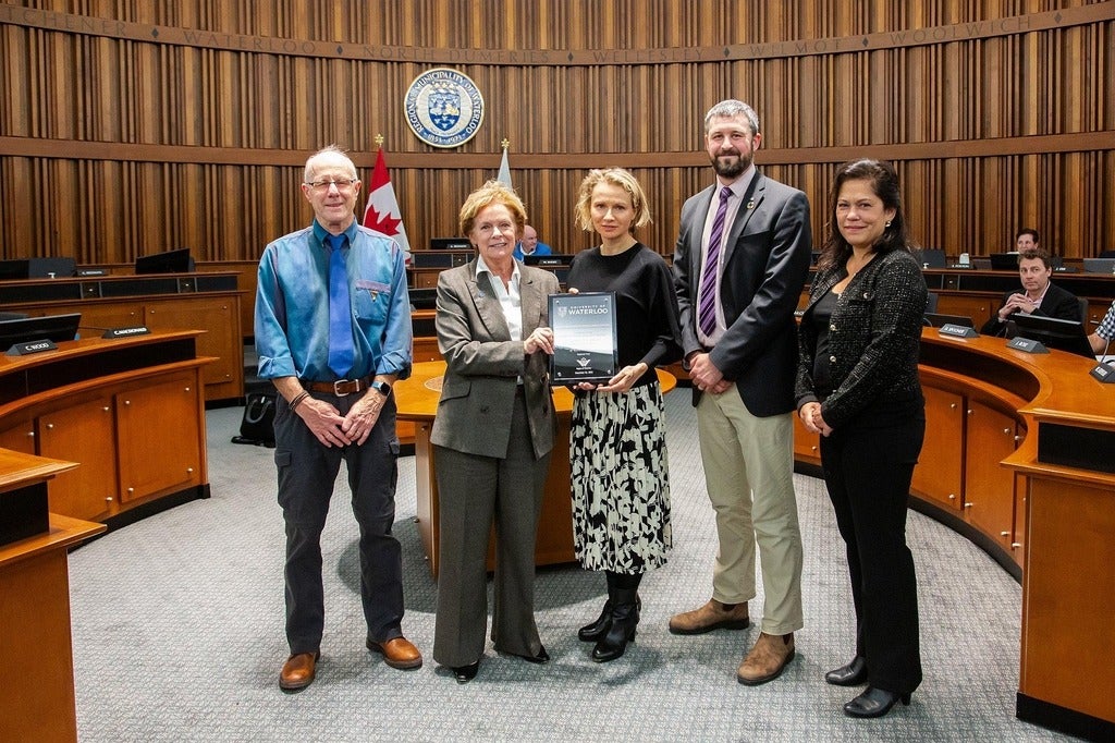 Waterloo's Mat Thijssen and Stepanka Elias accepting Water Efficiency Award from Regional Chair Karen Redmond in Regional Council.