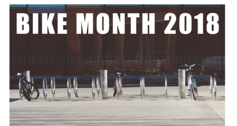 Bike Month 2018 with row of bike racks and bikes in front of DP library
