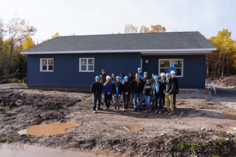 Warrior Home team in front of their completed home