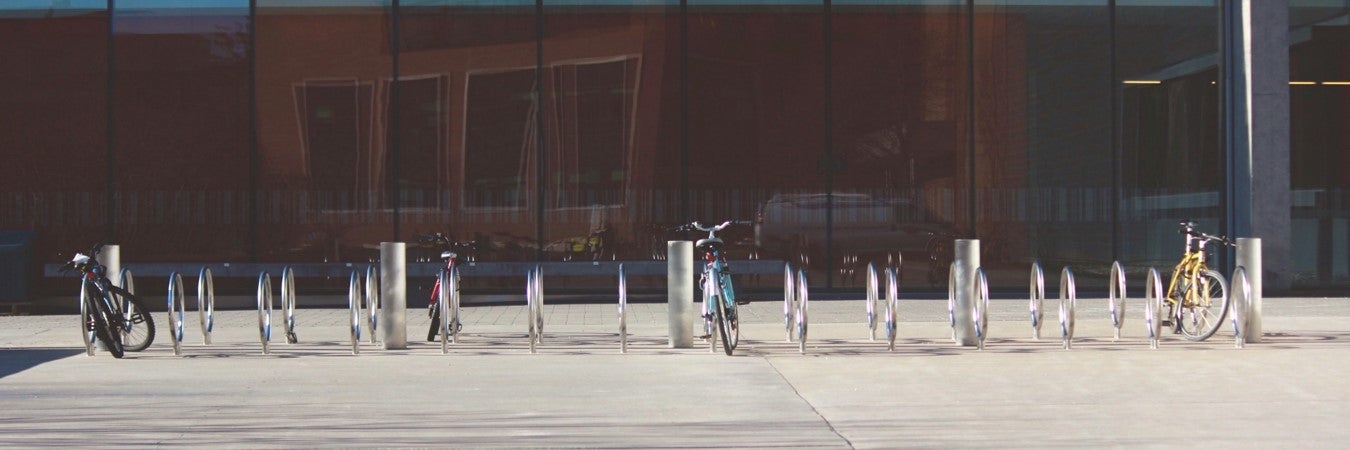 Row of bike racks with bikes outside DP library