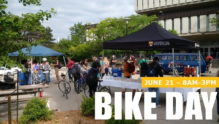 Bike Day crowd in 2016 in front of Dana Porter Library. Image shows "Bike Day June 21 from 8AM to 3PM