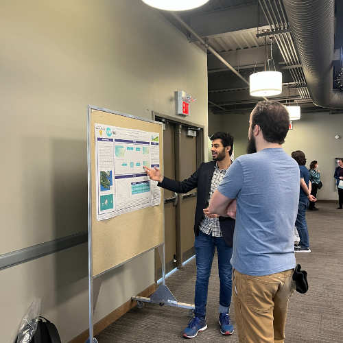Student presenting a poster