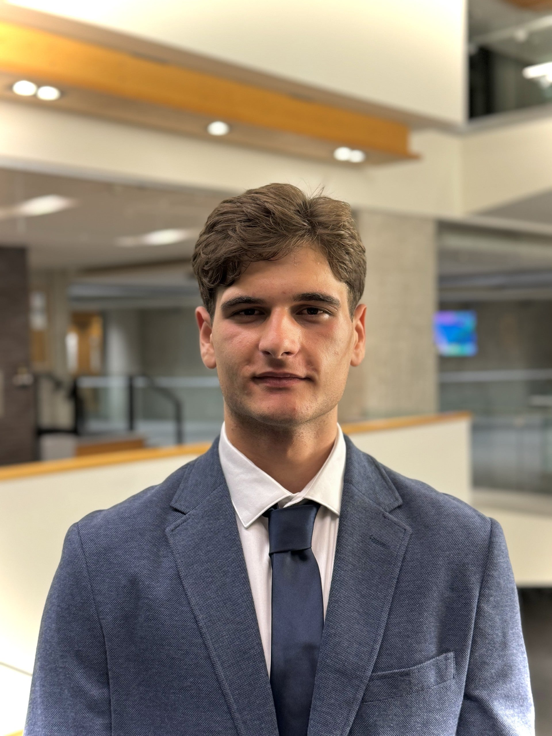 Headshot of Mihajlo in a suit