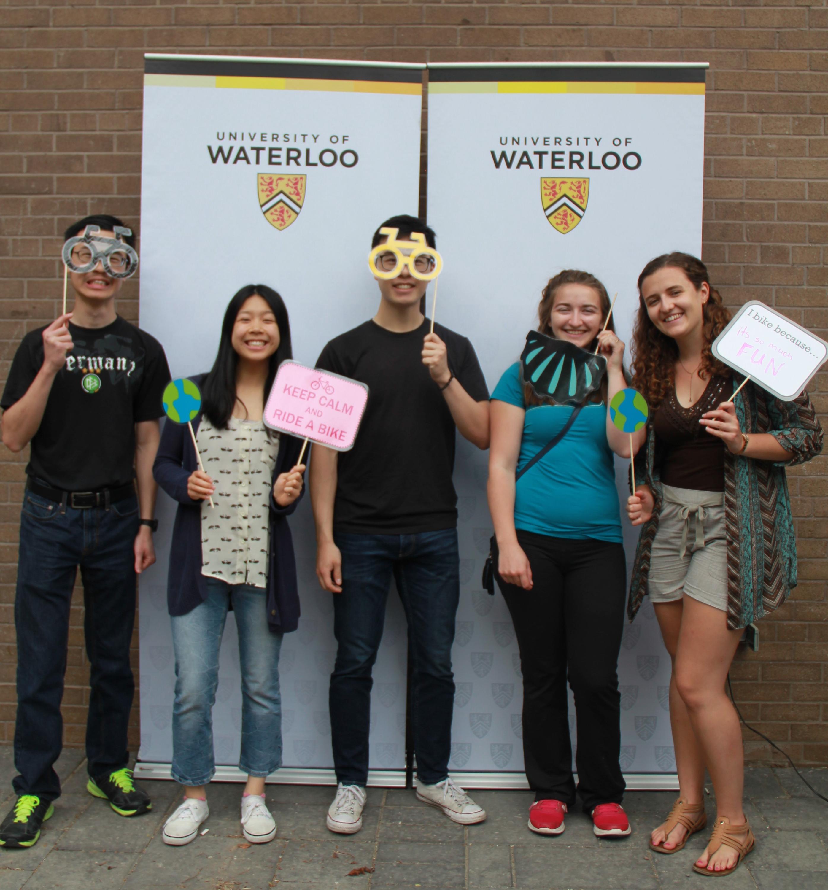 Five students with photobooth props at Bike Lunch