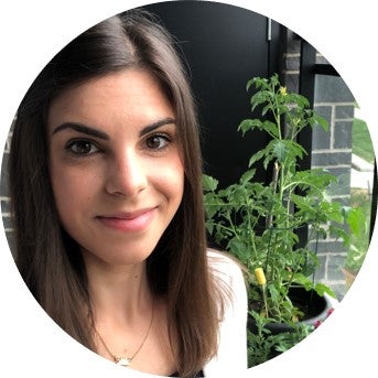 Nicole Pin headshot with plants