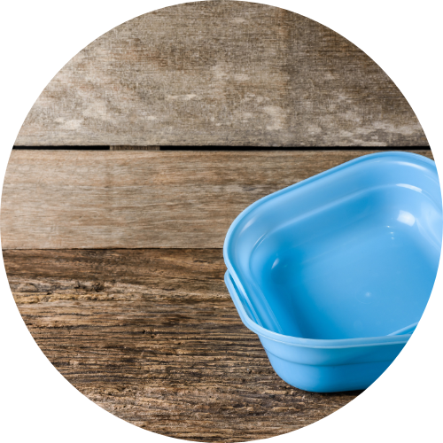 Blue reusable container on wood table