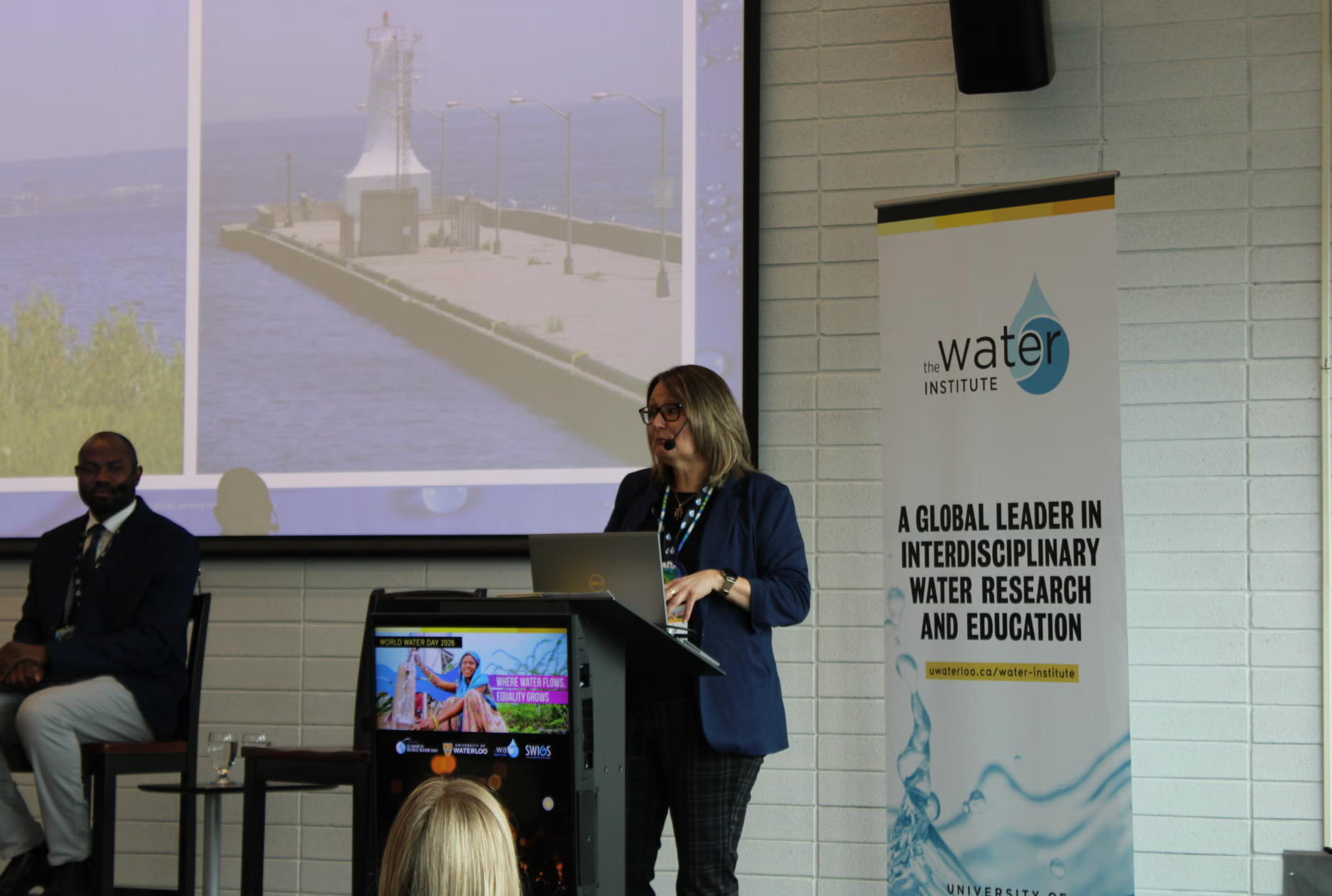 One of the panelists presenting at the podium