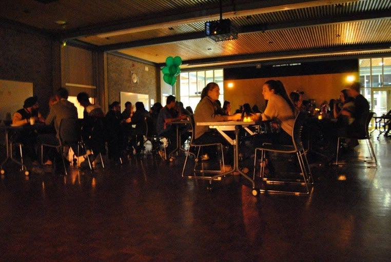 Students celebrating earth hour by candlelight