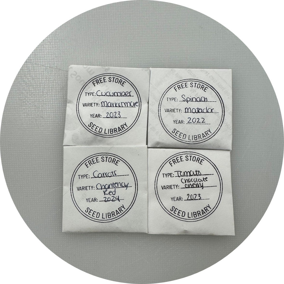 Four packages of different seeds from the Seed Library
