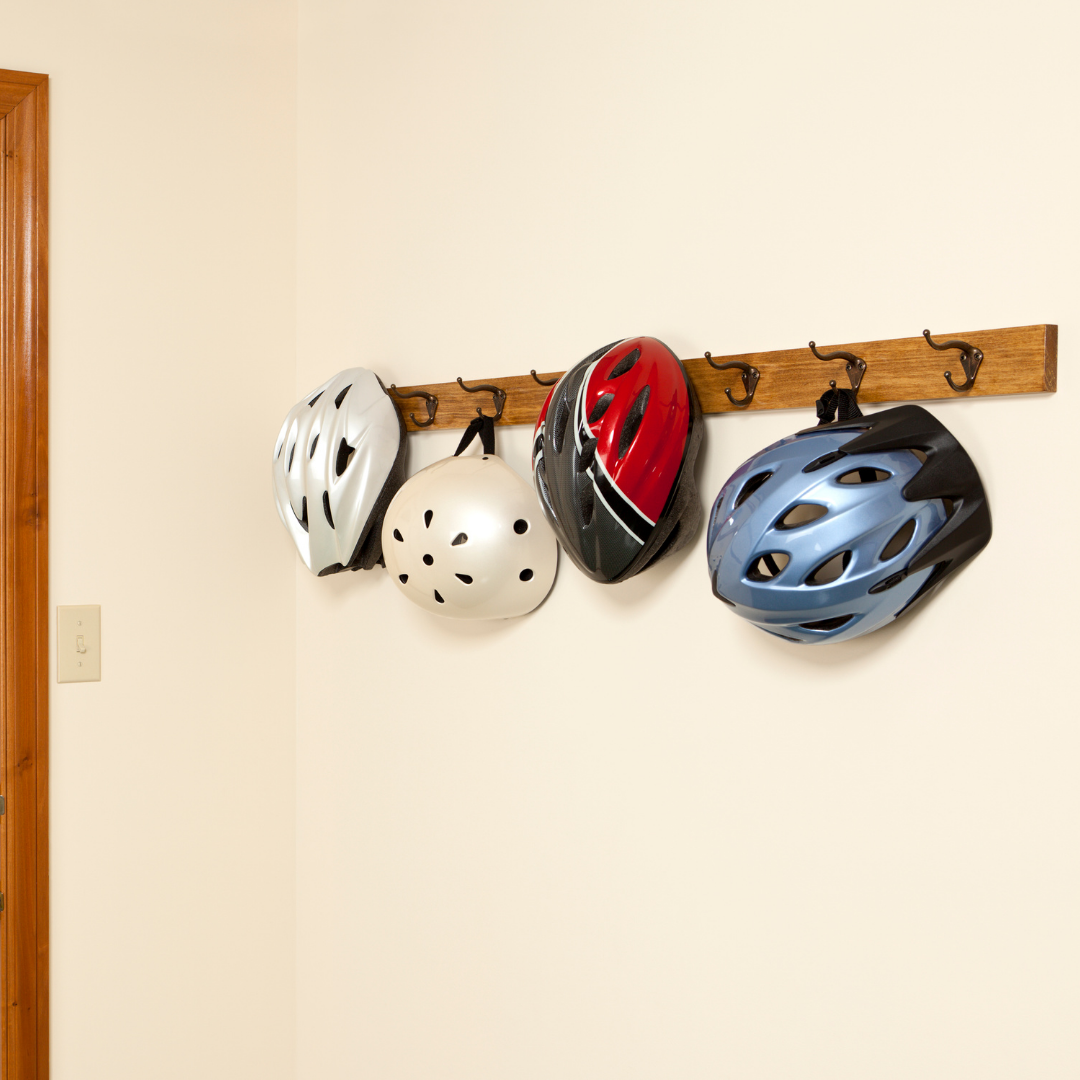 Helmets hanging on a hanger