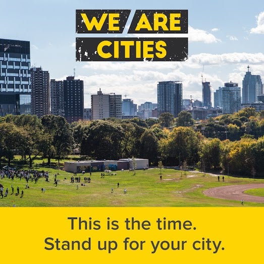 Urban landscape with We Are Cities logo
