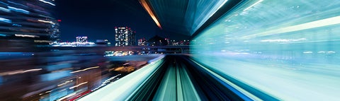 Action shot of high-speed rail at night.