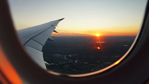 Sunset outside airplane window 